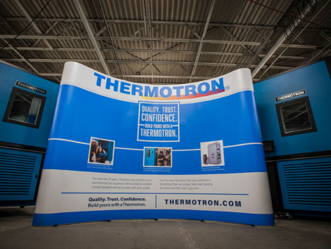 The curved trade show display creates an inviting atmosphere, highlights the three reasons customers choose Thermotron, and incorporates the current tagline "Quality. Trust. Confidence. Build yours with a Thermotron."